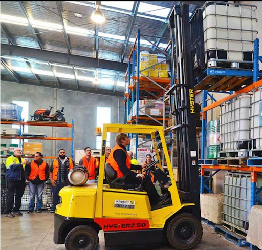 Man using forklift in warehouse