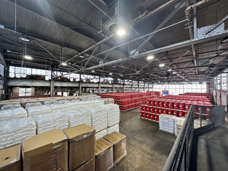Wide angle view of a large hazardous warehouse near NYC filled with chemical storage